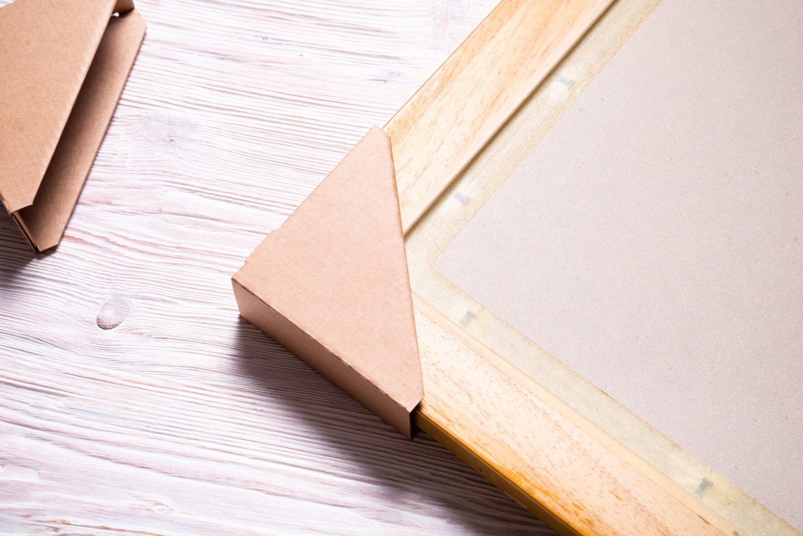 brown cardboard carton picture frame corner protectors