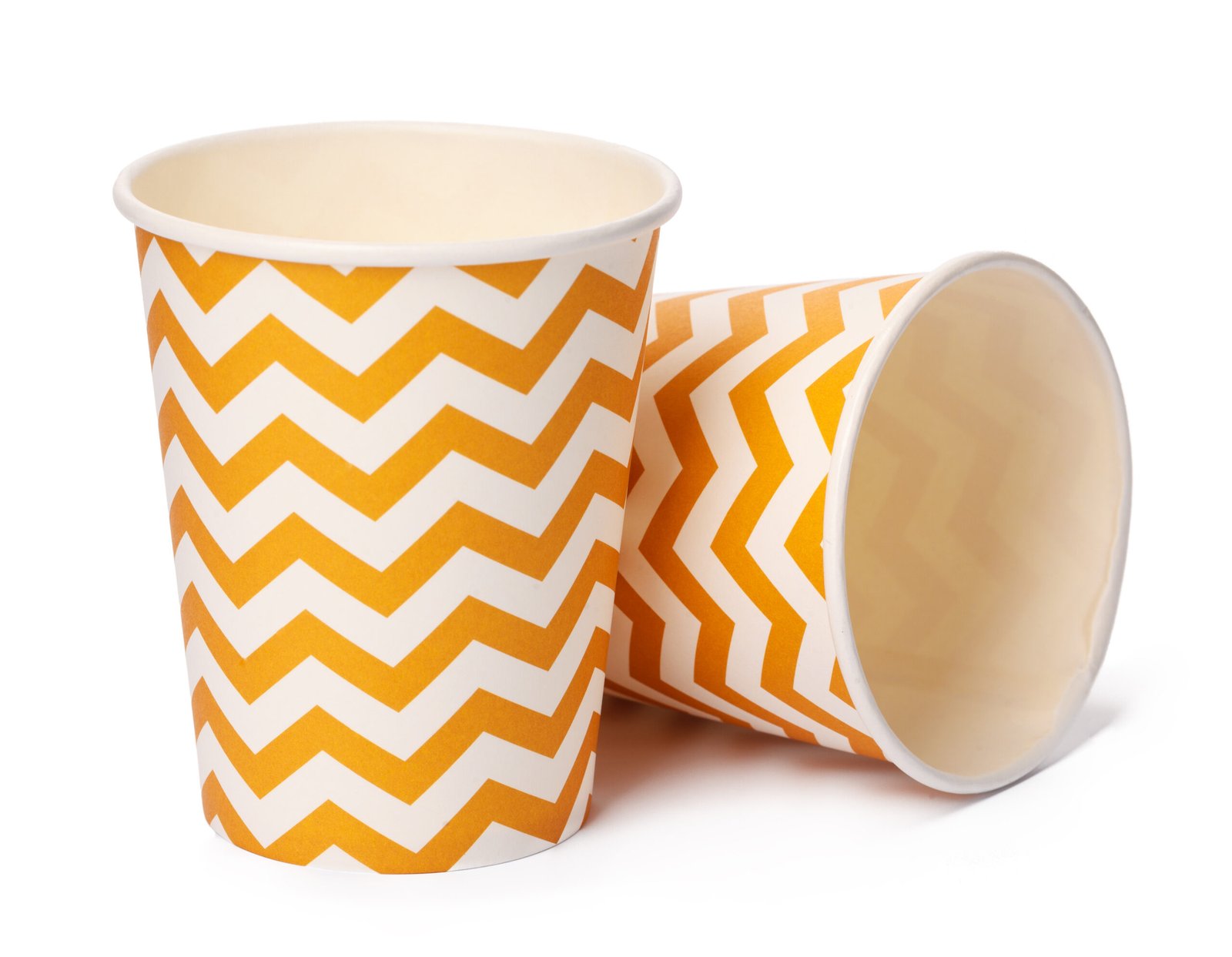 pile of cardboard cups with beige geometric pattern isolated on white background